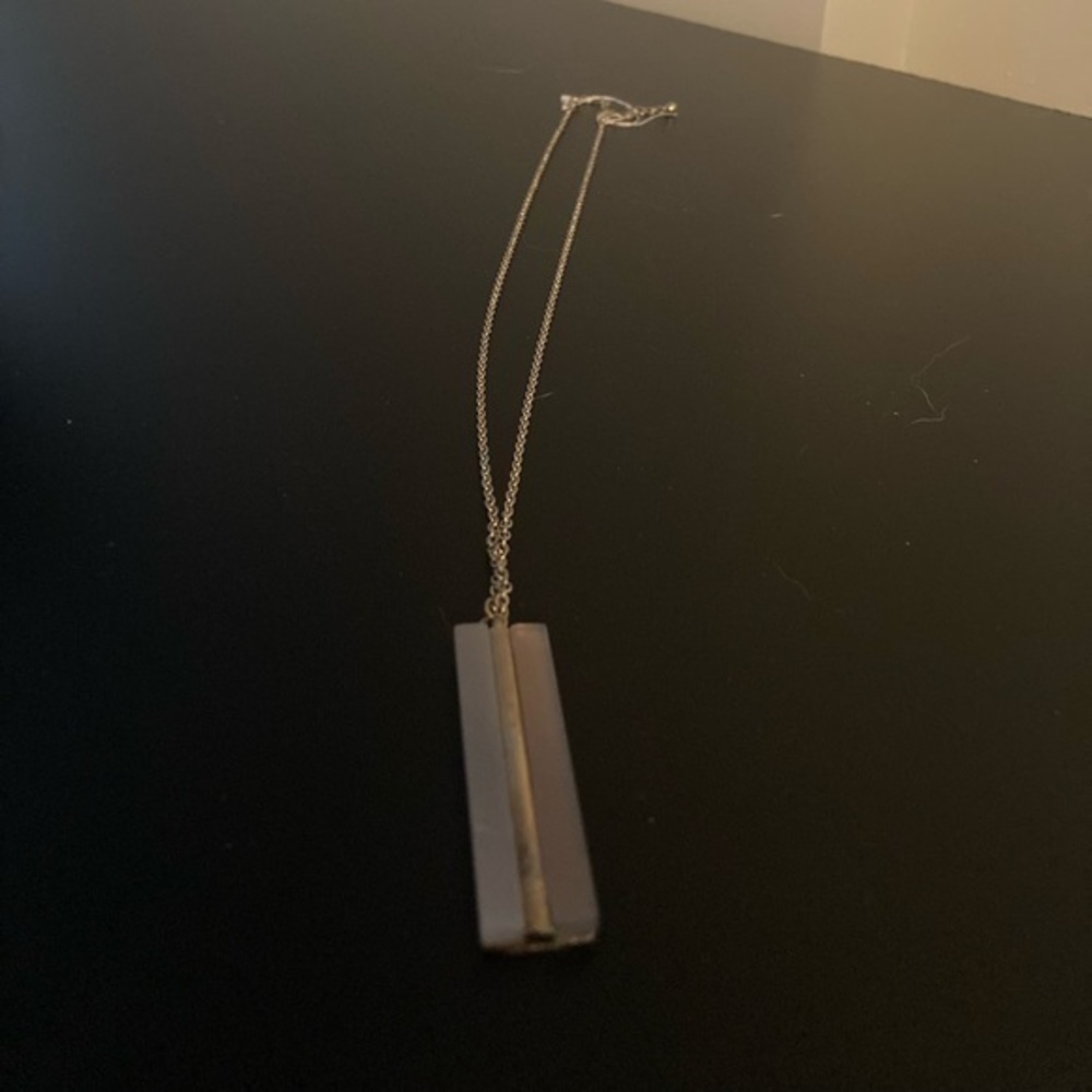Long chain with pendant.